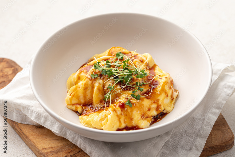 Portion of asian style scrambled eggs breakfast with herbs Portion of asian style scrambled eggs breakfast with herbs
