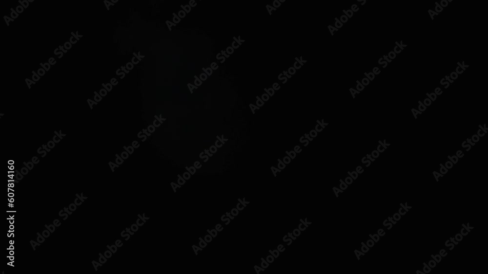 Light abstract animation of the transition with bright rays on a blurred bokeh background for video editing. Spectacular transition in video: Light glow and rays superimposed on an abstract background