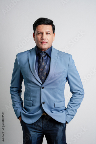 Young indian businessman Giving expression on white background.