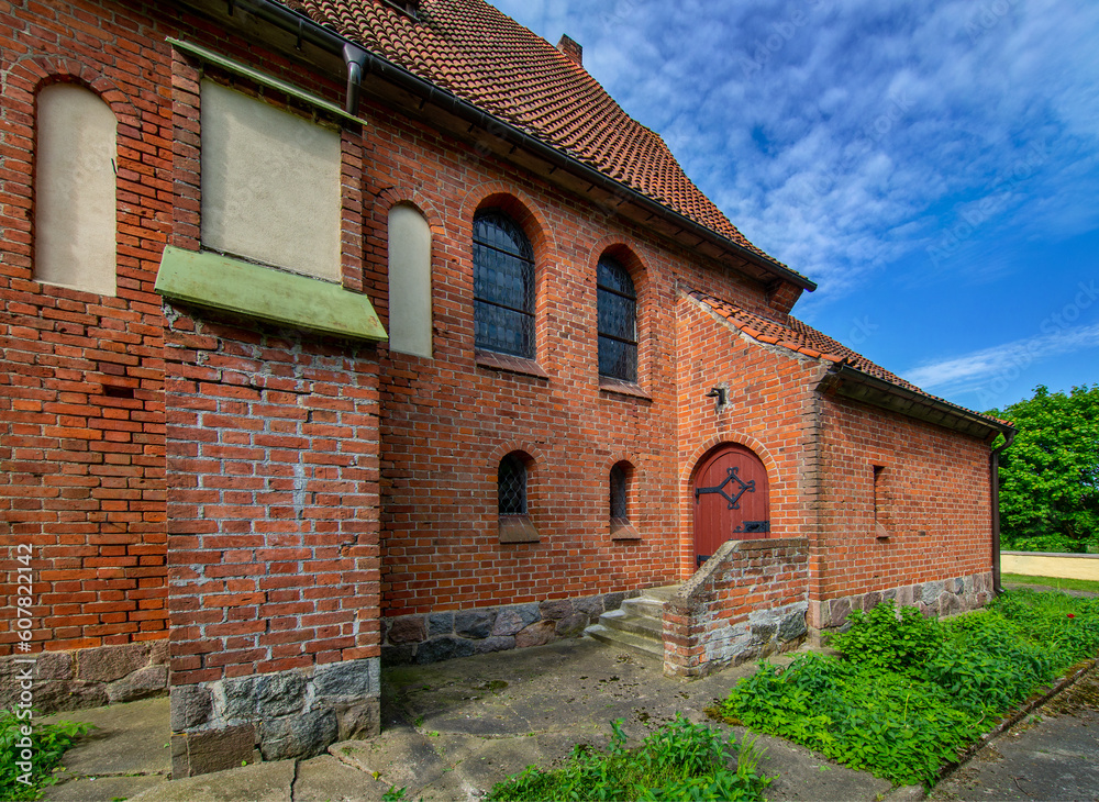 General view and close-up of architectural details of the St. Anthony of Padua Catholic Church built in 1911 in Sarnowo, Masuria, Poland. General view and close-up of architectural details of the St. Anthony of Padua Catholic Church built in 1911 in Sarnowo, Masuria, Poland.