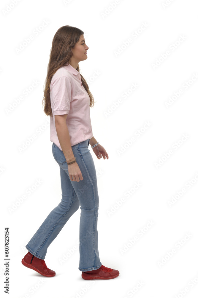 side view of a young girl walking on white background side view of a young girl walking on white background
