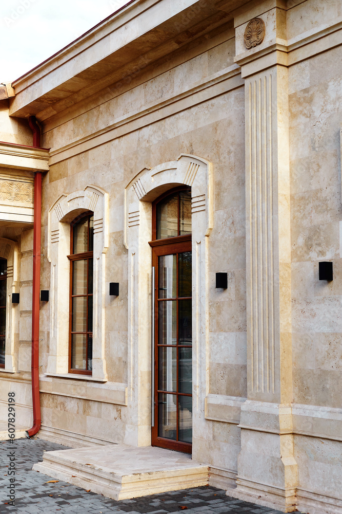 Building facade made of stacked travertine blocks