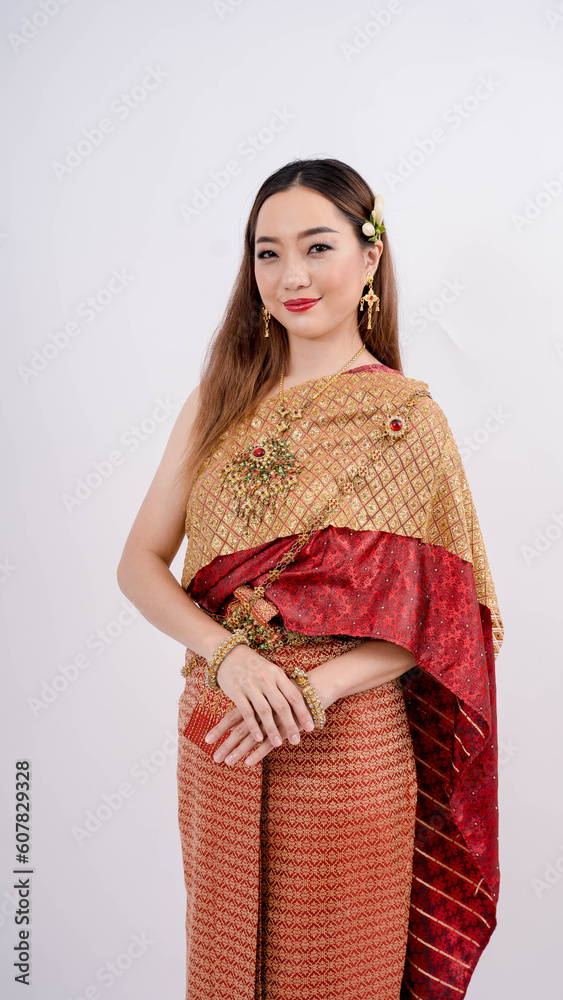 Luxury portrait of a beautiful Thai girl in traditional thai costume smiling isolated on white background Luxury portrait of a beautiful Thai girl in traditional thai costume smiling isolated on white background