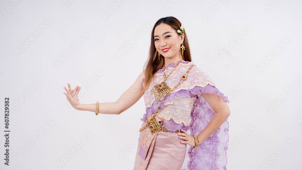 Luxury portrait of a beautiful Thai woman in traditional thai costume posing thai dance isolated on white background Luxury portrait of a beautiful Thai woman in traditional thai costume posing thai dance isolated on white background