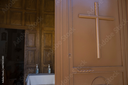 Parish church entrance with dispensers of hand sanitizer gel