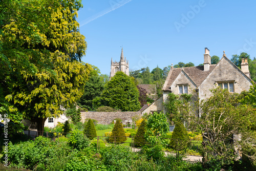 View of village and church Castle Combe Wiltshire England UK