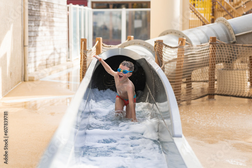 Boy trying to get out through a water channel photo