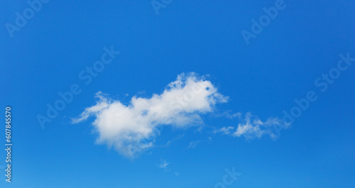 Blue sky and white clouds on a clear day. High quality photo. Copy space.