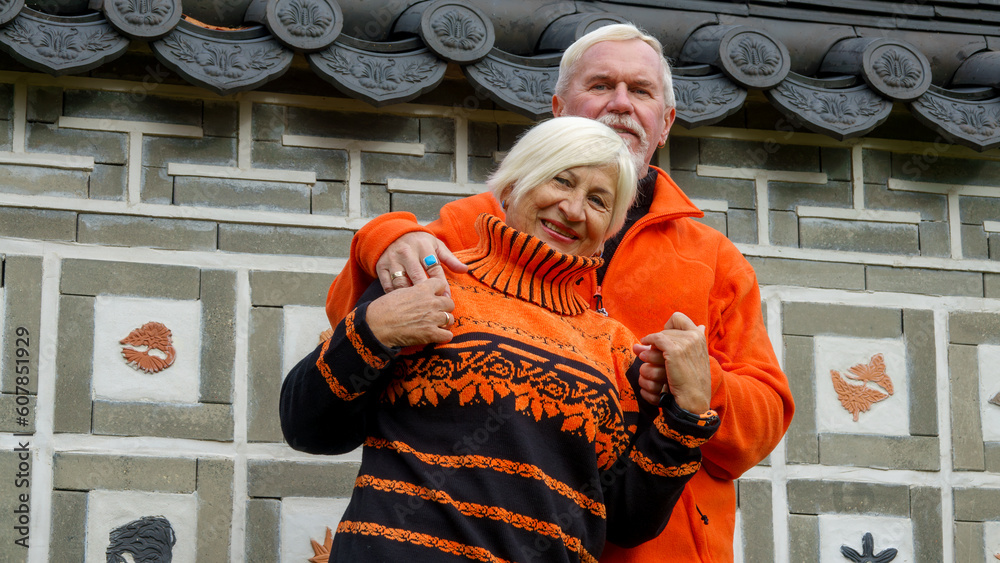 Elderly gray-haired optimistic couple
