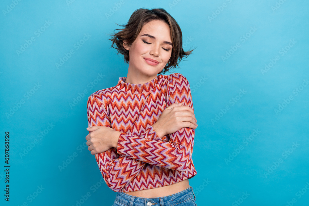 Photo of dreamy sweet lady wear pink shirt closed eyes embracing herself isolated blue color background - obrazy, fototapety, plakaty 