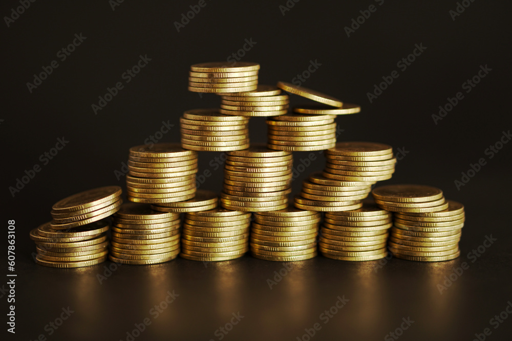 Stack of coins on black background, Saving money concept Stack of coins on black background, Saving money concept