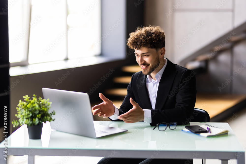 Fototapeta premium Businessman participate at virtual distant negotiations with colleagues via teleconference.
