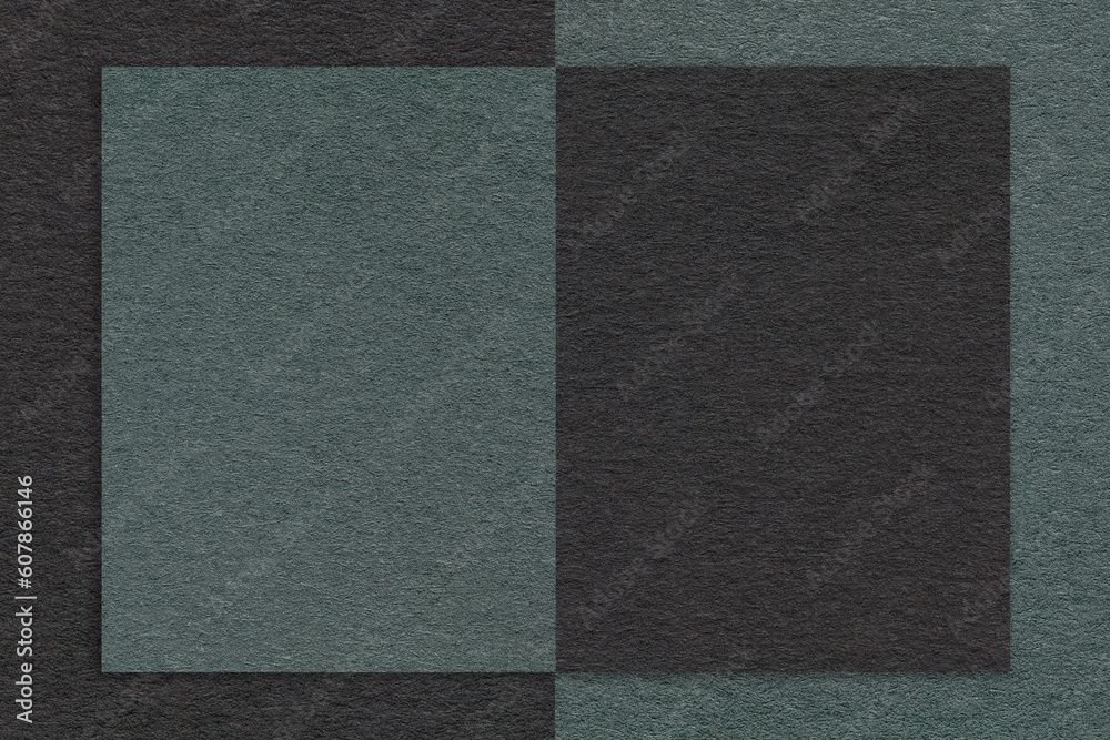 Fototapeta premium Texture of black and dark green and teal paper background with geometric shape and pattern, macro. Craft cardboard