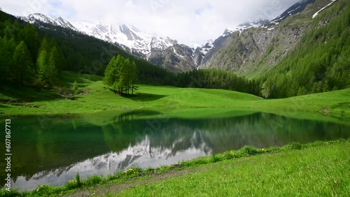 Serene Beauty of Laghetto naturale di Bout du Col during spring, Natural Pond of Bout du Col, Prali, Turin province, Piedmont photo