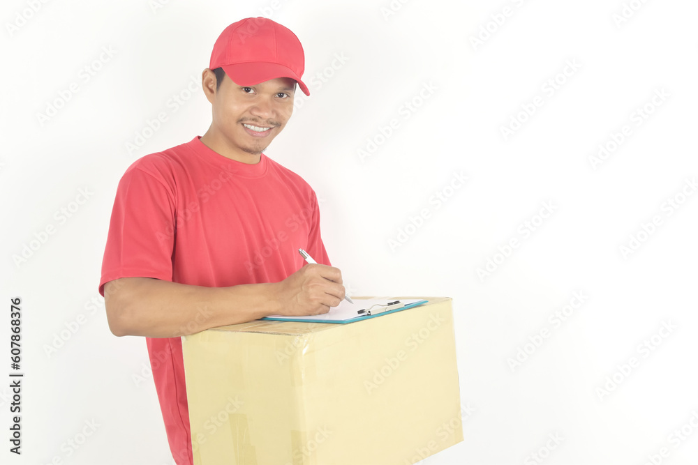 Delivery man writing on a clipboard with parcel post boxes on white background. Delivery man writing on a clipboard with parcel post boxes on white background.