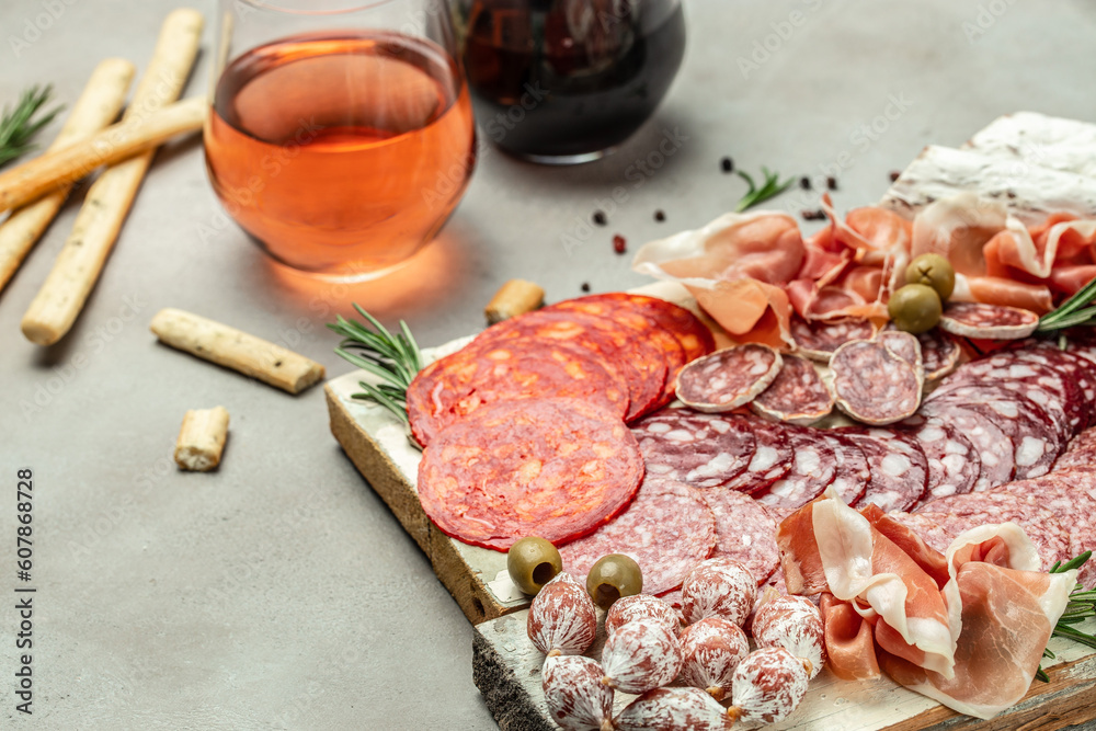 Variety of dry cured fuet and chorizosalami sausages, Meat platter. Mixed delicatessen of meat snacks. place for text, top view Variety of dry cured fuet and chorizosalami sausages, Meat platter. Mixed delicatessen of meat snacks. place for text, top view