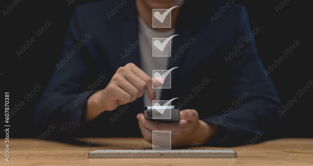 Business performance checklist, businessman using laptop doing online checklist survey, filling out digital form checklist, take an assessment, questionnaire, evaluation, online survey.	