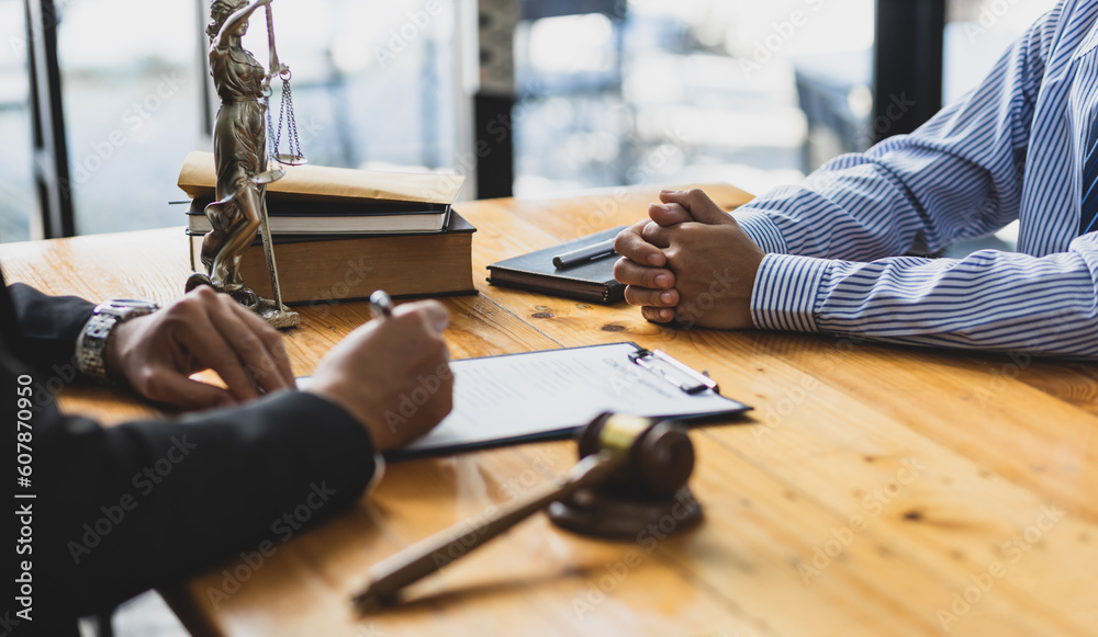 Fototapeta premium Legal consulting services, legal negotiations, Lawyers are signing legal contract agreement documents.