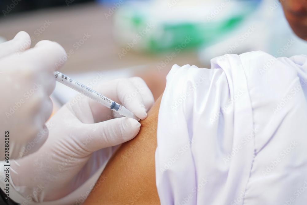 Nurse holding a syringe for the injection giving patient vaccine in hospital. Health care Concept Nurse holding a syringe for the injection giving patient vaccine in hospital. Health care Concept
