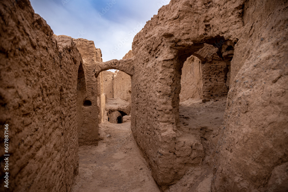 ancient medieval ruins of a city from clay and mud in iran desert street