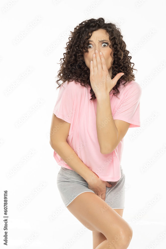young curly woman need a toilet on white background young curly woman need a toilet on white background