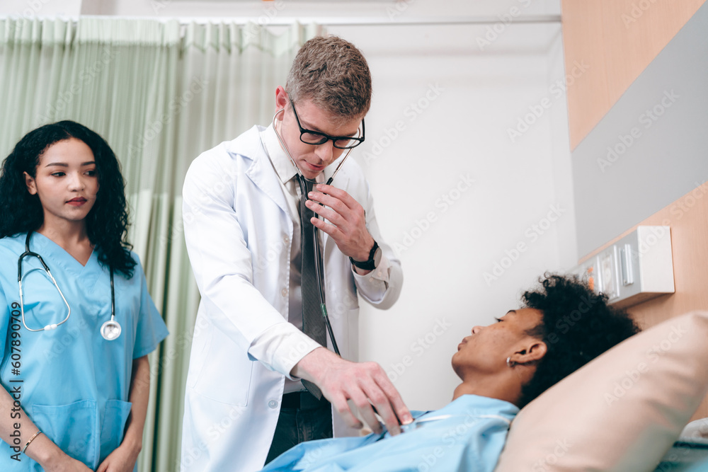 Obraz premium Professional doctor team using a stethoscope checking patient with examining in hospital, presenting results symptom and recommend treatment method, Healthcare and medical health insurance concept
