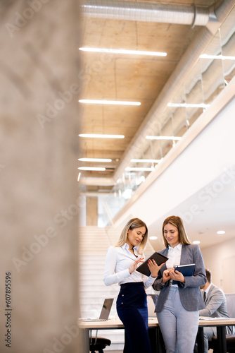 Two young business women lo...