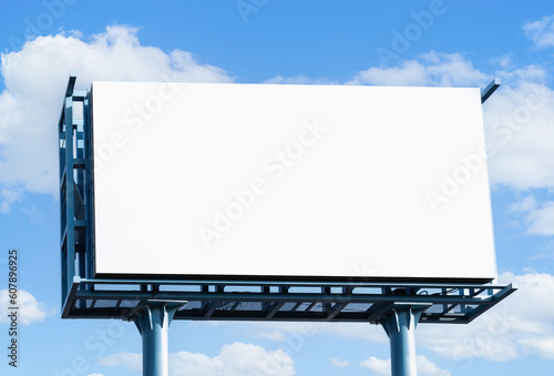 Horizontal blank billboard over blue sky
