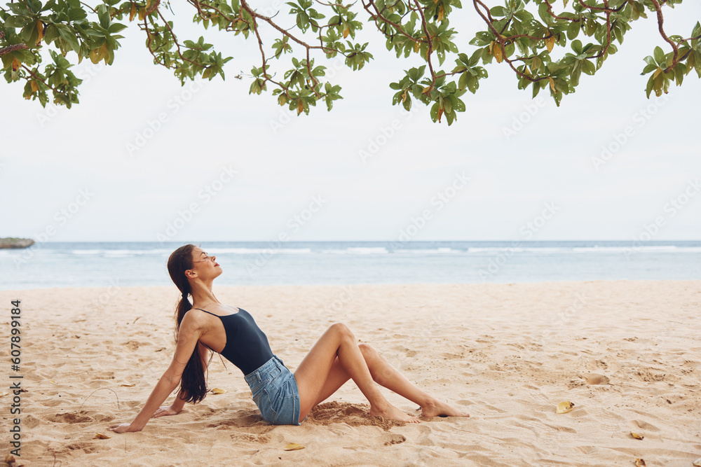 woman freedom sea hair nature sitting beach travel vacation smile sand woman freedom sea hair nature sitting beach travel vacation smile sand