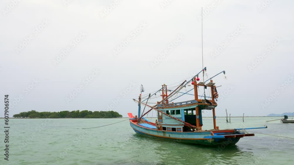 Typical Thai fishing boat on a beautiful clear water island of Koh Samui Typical Thai fishing boat on a beautiful clear water island of Koh Samui
