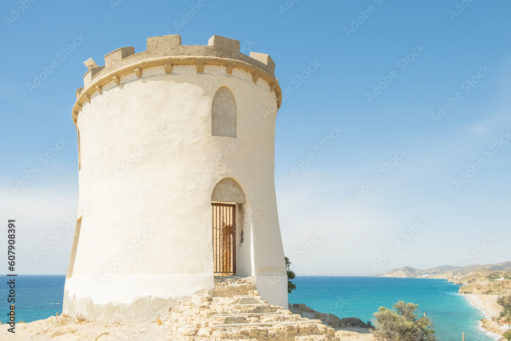 Villajoyosa, Spain. Old tower Torre de Malladeta and Mediterranean Sea. La Vila Joiosa is beautiful coastal town in Alicante province, Valencian Community, Spain