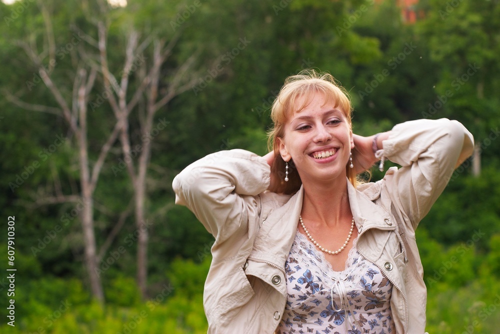 Young pretty woman at city park background Young pretty woman at city park background