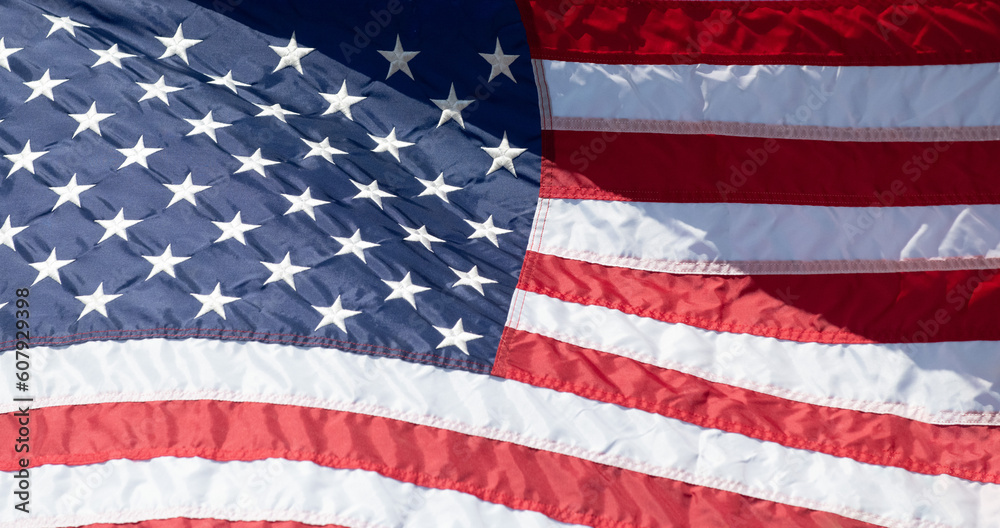 Fototapeta premium An American Flag waves in the breeze