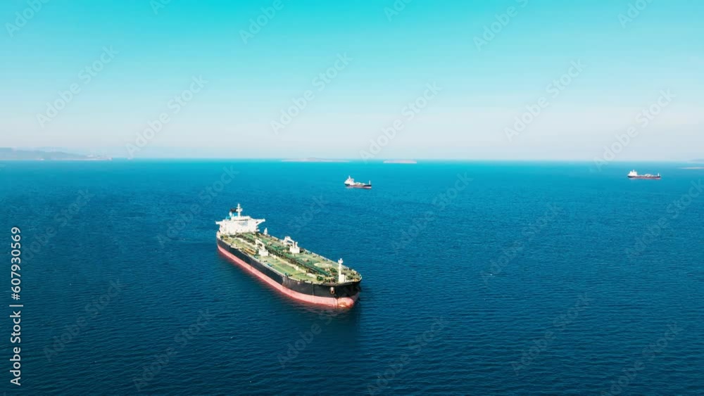 Crude oil tanker ship at anchorage in sea, logistic of crude oil for export or import by maritime vessel Crude oil tanker ship at anchorage in sea, logistic of crude oil for export or import by maritime vessel