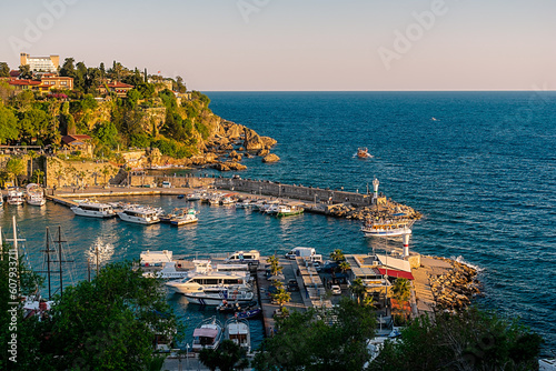 View from a height of the harbor near the old town of Kaleichi in the Turkish city of Antalya. Old port in Antalya with many ships and boats. Popular tourist place in Anatalya.