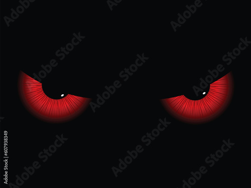 Red evil eyes on a black background photo