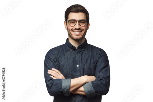 Young man wearing denim shirt standing with crossed arms