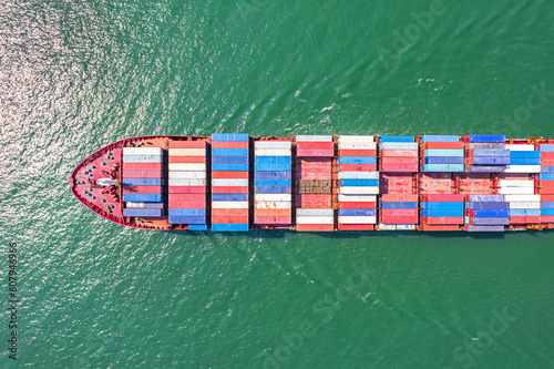 Aerial top view container cargo ship in import export business commercial trade logistic and transportation of international by container cargo ship