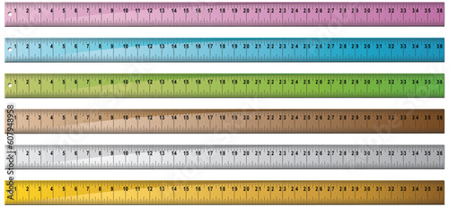 Set of 6 metal/wooden yardsticks with hole punch at end.  Rulers measured in inches with centimeter dashes.