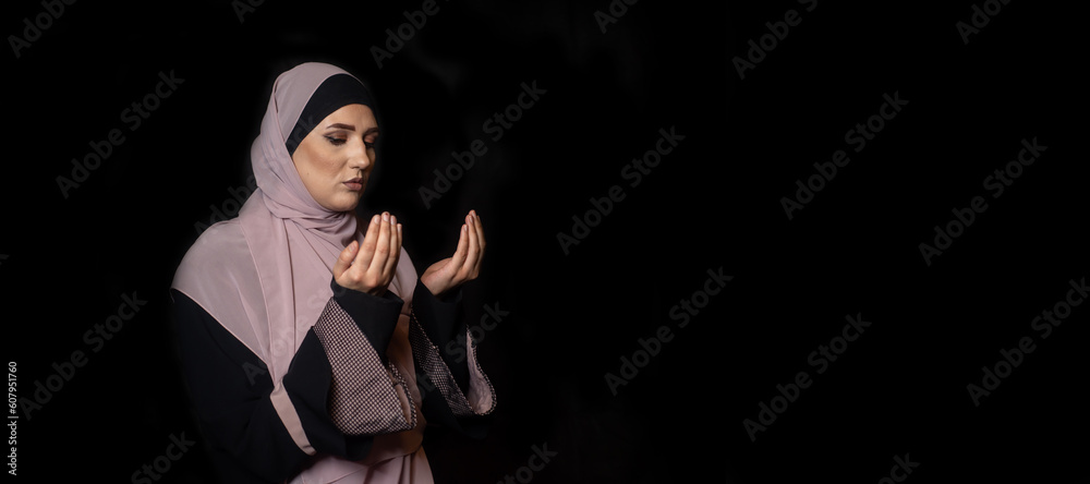 Muslim girly praying in house, reading holy Quran Muslim girly praying in house, reading holy Quran
