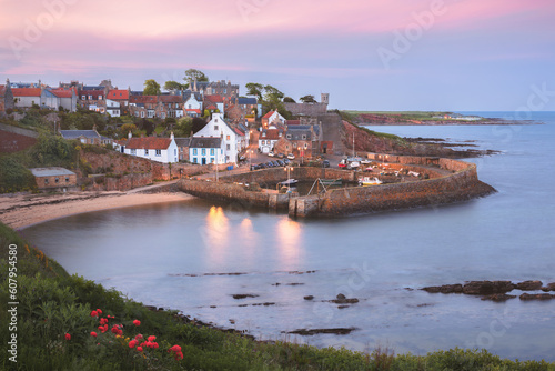 Scenic, picturesque sunset view of the charming coastal fishing village of Crail and its harbour in East Neuk, Fife, Scotland, UK. photo