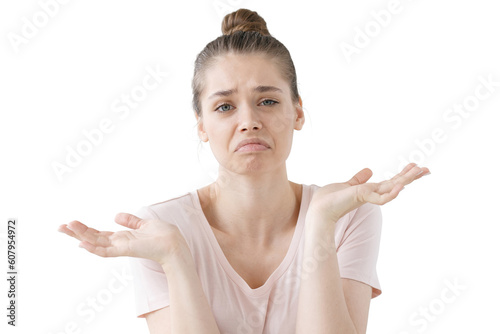 Canvastavla Closeup of emotional young woman isolated on grey background being at a loss, showing helpless gesture with arm and hands, mouth curved as if she does not know what to do with current situation