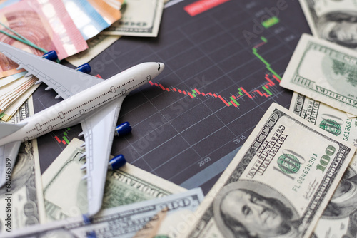 Plane on dollar cash background, travel with airplane concept.