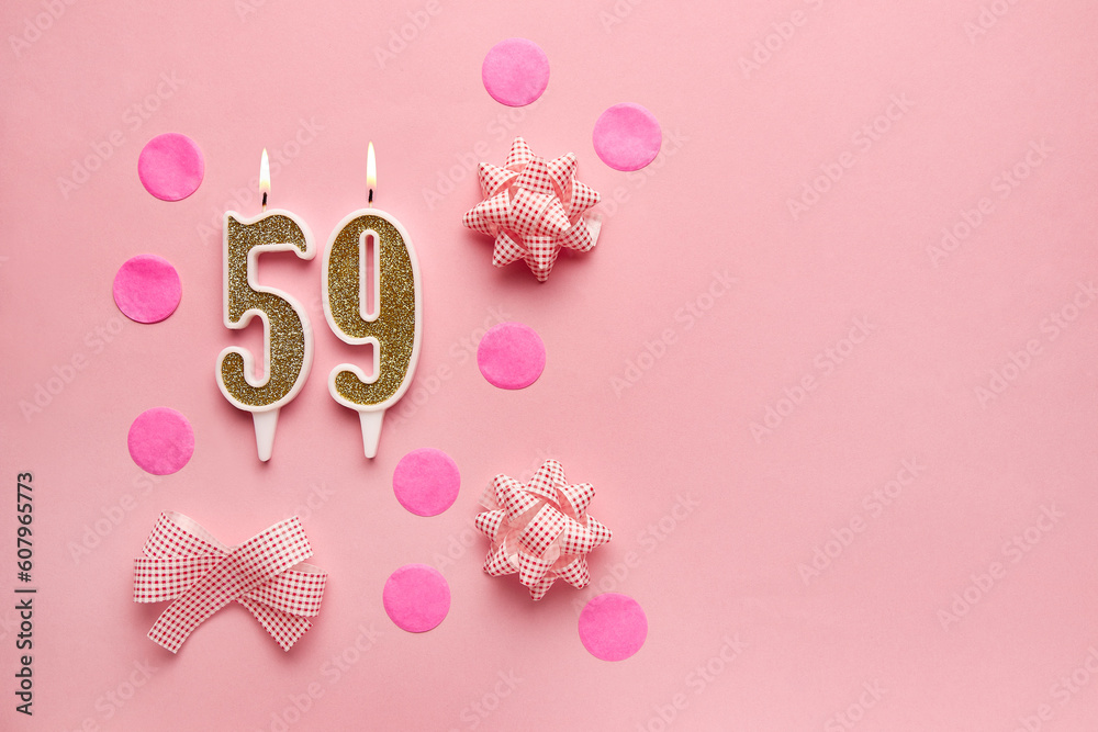 Number 59 on pastel pink background with festive decor. Happy birthday candles. The concept of celebrating a birthday, anniversary, important date, holiday. Copy space. Banner
