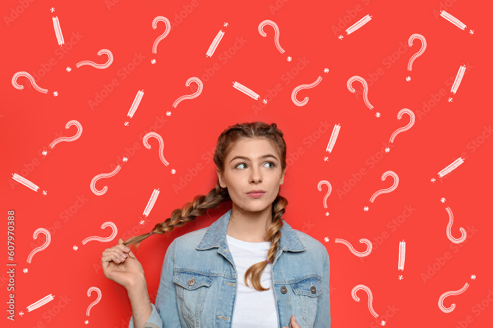 Thoughtful young woman with drawn question and exclamation marks on red ...