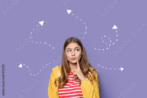 Thoughtful young woman on violet background