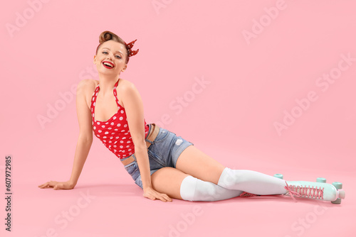 Young pin-up woman in rolle...