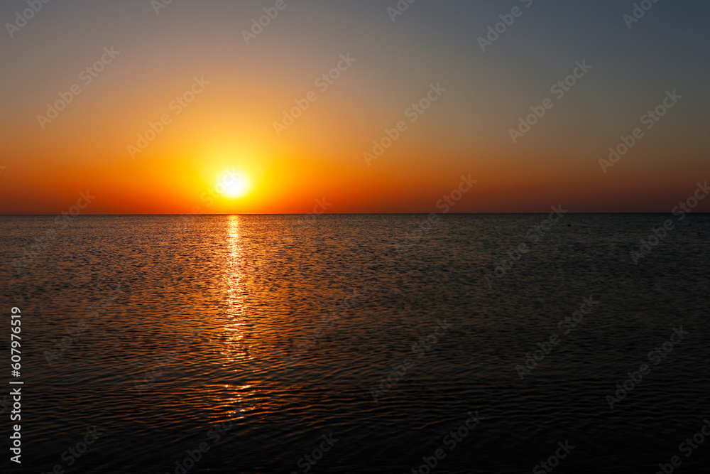 Amazing sunsrise over the sea, beautiful sunrise, 
reflections of the sun's rays in the sea