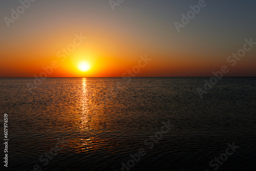 Amazing sunsrise over the sea, beautiful sunrise,  reflections of the sun's rays in the sea © Martin