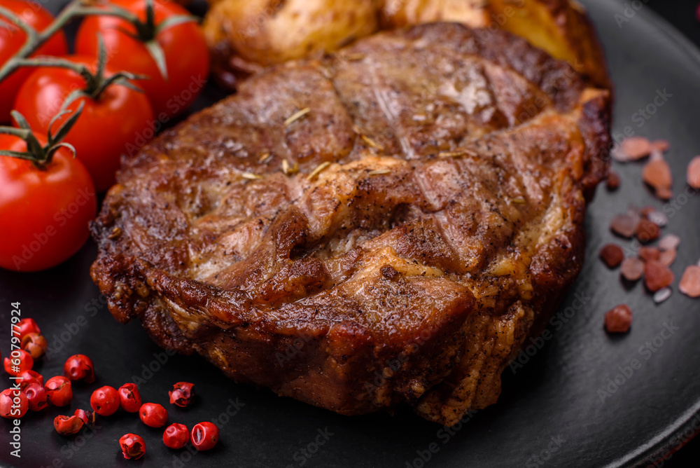 Delicious juicy pork or beef steak grilled with salt, spices and herbs